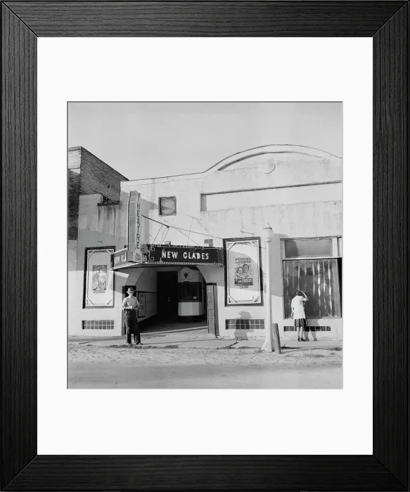 Framed Print : Movie theatre, the New Glades theater, with posters advertising PENNIES FROM HEAVEN, and THE SAINT IN NEW YORK, Moore Haven, Florida, photograph by Marion Post Wolcott, January Framed Print : Movie theatre, the New Glades theater, with posters advertising PENNIES FROM HEAVEN, and THE SAINT IN NEW YORK, Moore Haven, Florida, photograph by Marion Post Wolcott, January