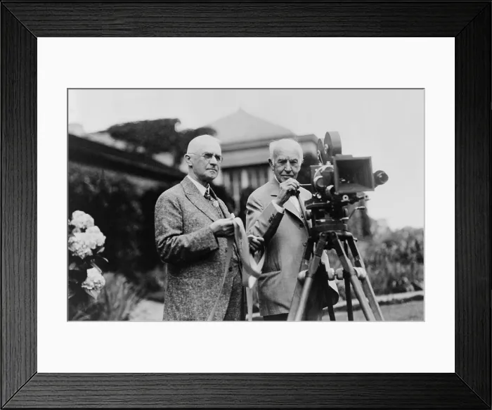 Framed Print : Thomas Edison 1847-1931 and George Eastman 1854-1932 standing with motion picture camera ca. 1925. (BSLOC_2010_18_127) Framed Print : Thomas Edison 1847-1931 and George Eastman 1854-1932 standing with motion picture camera ca. 1925. (BSLOC_2010_18_127)