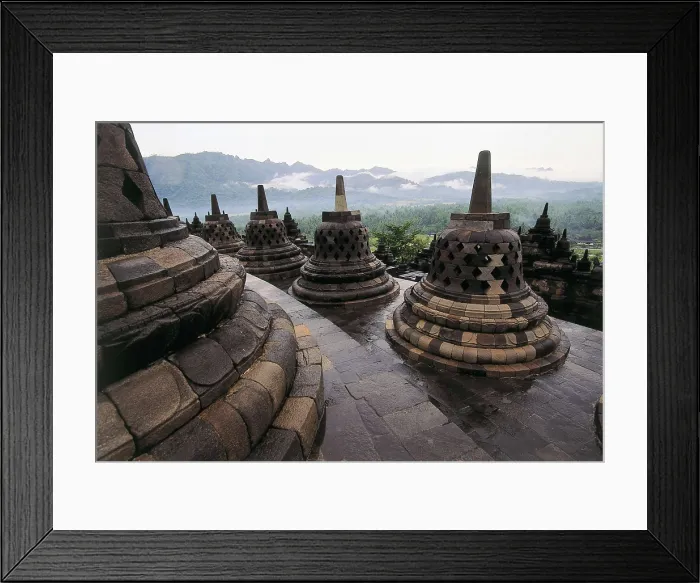 Framed Print : Borobudur Temple. 9th c. INDONESIA. CENTRAL JAVA. Borobudur. Bell-shaped stupas on the roof of the temple. AISA / Everett Collection**US SALES ONLY** Framed Print : Borobudur Temple. 9th c. INDONESIA. CENTRAL JAVA. Borobudur. Bell-shaped stupas on the roof of the temple. AISA / Everett Collection**US SALES ONLY**