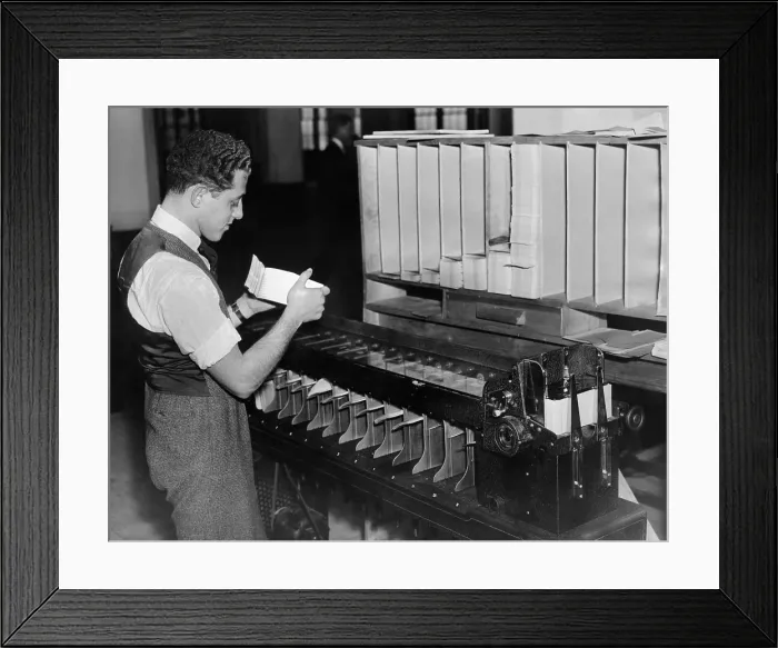 Framed Print : Information technology installed in the Social Security Department. A worker at of the automatic card sorters as it was being operated. Nov. 27, 1936