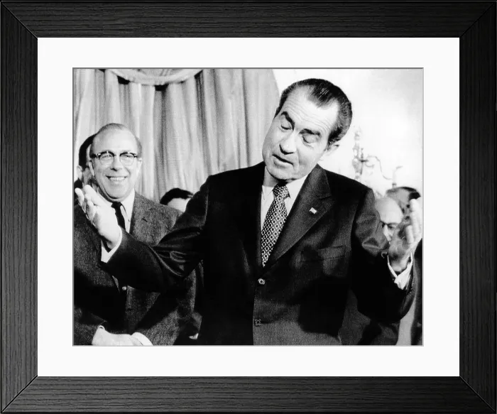 Framed Print : President Richard Nixon shrugs and gestures before signing the budget for fiscal 1972