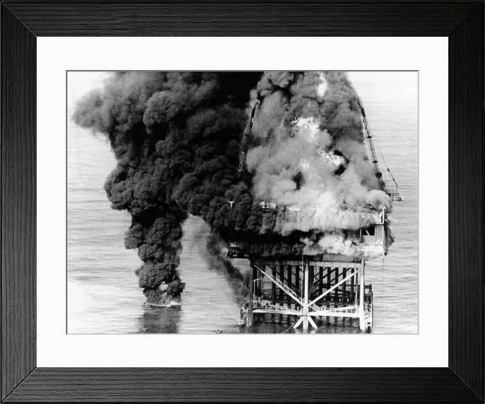 Framed Print : Oil platform blaze at Grand Isle, Louisiana. Two workers died by drowning when they jumped off the 70-foot-high platform to avoid the fire. Dec. 1, 1970