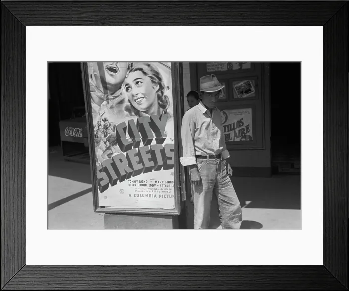 Framed Print : Mexican man in front of a movie theater playing CITY STREETS, San Antonio, Texas, photograph by Lee Russell, 1939