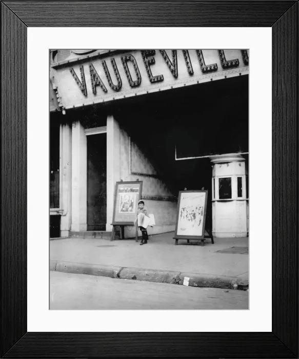 Framed Print : Child labor in front of a movie theater