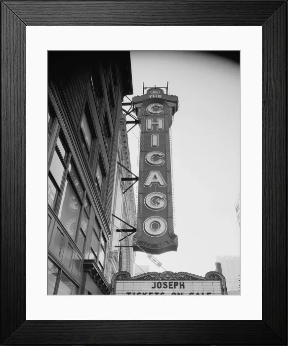 Framed Print : The Chicago Theater, constructed in 1921, photograph shows the sign and the Page Brothers building to the right, 175 North State Street, Chicago, Illinois, circa 1990s