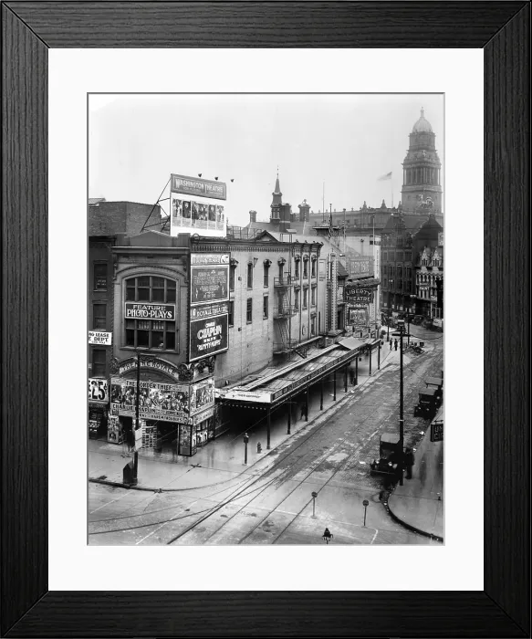 Framed Print : Movie Theaters, the Theatre Royale (left), playing THEIR COMPACT, and the Charles Chaplin film THE FALL OF THE RUMMY-NUFFS, and the Liberty Theatre (back right)