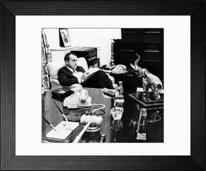Framed Print : President Richard Nixon in his office in the White House residence. On the desk are souvenirs from his long political career. Between 1969-Jan. 1971 Framed Print : President Richard Nixon in his office in the White House residence. On the desk are souvenirs from his long political career. Between 1969-Jan. 1971