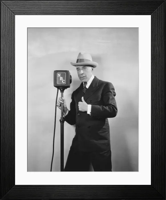 Framed Print : Legendary movie director D. W. Griffith broadcasting, D. W. Griffith's Hollywood. Ca. 1930. The NBC radio program was a review of his life and history of Hollywood