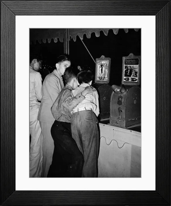 Framed Print : Boys looking at penny movies at South Louisiana State Fair, viewing WIGGLING WONDERS, next to a machine showing Charlie Chaplin in THE DUMB WAITER, photograph by Lee Russell Framed Print : Boys looking at penny movies at South Louisiana State Fair, viewing WIGGLING WONDERS, next to a machine showing Charlie Chaplin in THE DUMB WAITER, photograph by Lee Russell