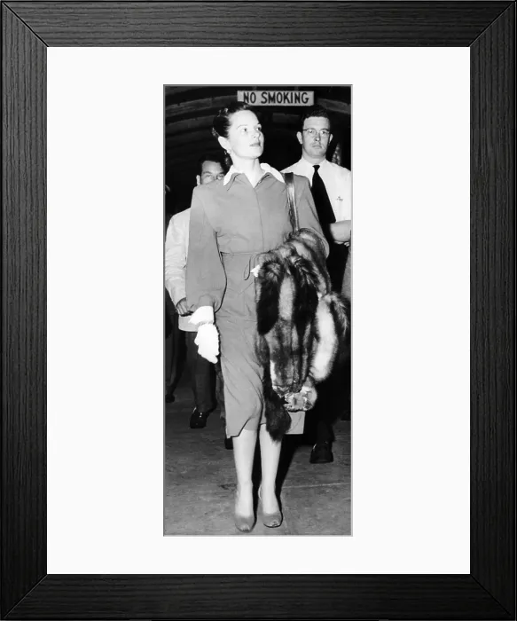 Framed Print : Virginia Hill arriving at New York Airport on August 8, 1947, a month after Bugsy Seigel was killed. She did not rush back from France after his murder