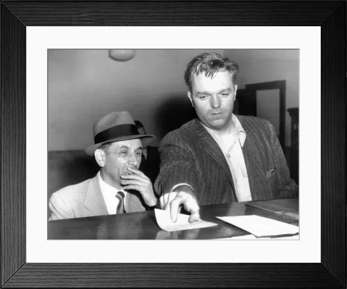 Framed Print : Meyer Lansky is booked on vagrancy charges at the West 54th Street police station in Manhattan