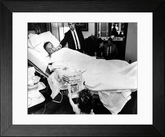 Framed Print : President Lyndon Johnson after gall bladder surgery. He shows a headline about his operation to Courtenay Valenti, daughter, Jack Valenti, at Bethesda Naval Hospital Framed Print : President Lyndon Johnson after gall bladder surgery. He shows a headline about his operation to Courtenay Valenti, daughter, Jack Valenti, at Bethesda Naval Hospital