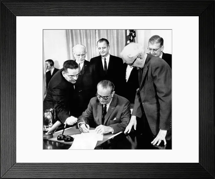 Framed Print : President Lyndon Johnson signs the 24th Amendment to the Constitution. It prohibits payment of a poll tax or other types of tax as a requirement for voting in federal elections Framed Print : President Lyndon Johnson signs the 24th Amendment to the Constitution. It prohibits payment of a poll tax or other types of tax as a requirement for voting in federal elections