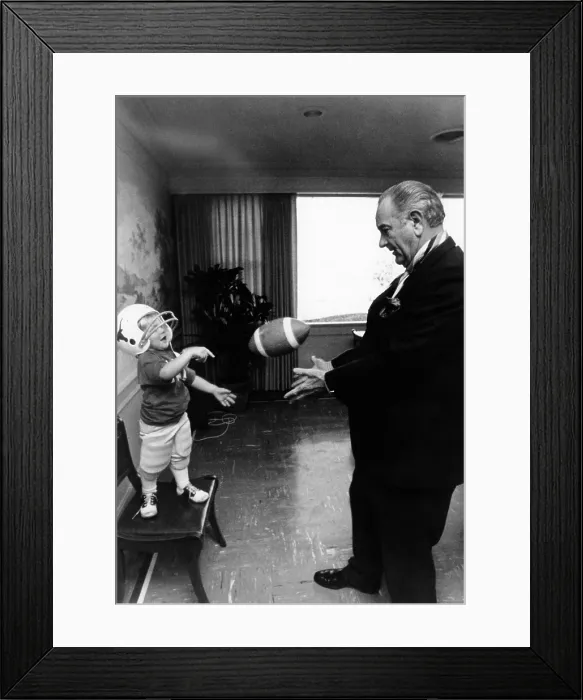 Framed Print : Former President Lyndon Johnson plays with his grandson, Lyn Nugent. Lyn is wearing a helmet as they toss a football. May 19, 1971. (CSU_ALPHA_719) CSU Archives / Everett Collection Framed Print : Former President Lyndon Johnson plays with his grandson, Lyn Nugent. Lyn is wearing a helmet as they toss a football. May 19, 1971. (CSU_ALPHA_719) CSU Archives / Everett Collection