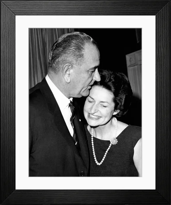 Framed Print : President Lyndon Johnson kisses his wife Lady Bird as they greet guests at the White House. He was hosting a dinner of the Business Council. Jan. 7, 1964