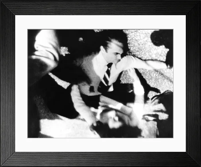 Framed Print : George Wallace was shot four times by Arthur Bremer while campaigning in Laurel, Maryland. Television image showed Cornelia Wallace kneeling over him on May 15, 1972