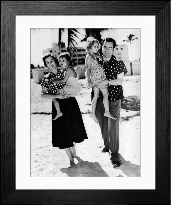 Framed Print : Vice President-elect Richard Nixon, carry daughter Tricia, and Pat with Julie on vacation. They stroll Miami beach during a short post-election get away. Nov. 11, 1952 Framed Print : Vice President-elect Richard Nixon, carry daughter Tricia, and Pat with Julie on vacation. They stroll Miami beach during a short post-election get away. Nov. 11, 1952
