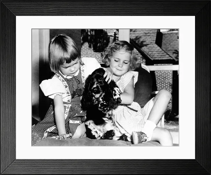 Framed Print : Julie and Tricia Nixon playing with their cocker spaniel, Checkers