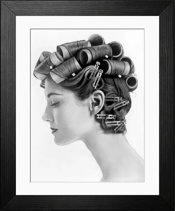 Framed Print : 1960s bouffant hair styles were created with big rollers on top of the head and pin curls to create a soft flip up at the neck. Profile view. June 25, 1962 Framed Print : 1960s bouffant hair styles were created with big rollers on top of the head and pin curls to create a soft flip up at the neck. Profile view. June 25, 1962
