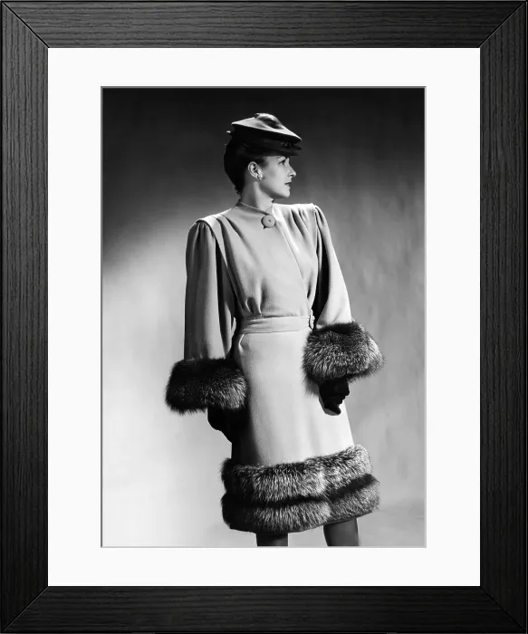 Framed Print : Luxurious fur trimmed dress of 1945, by Hans Geiger of New York. It features extremely broad padded shoulders, with bodice fullness shaped by pleats at from the shoulder seams