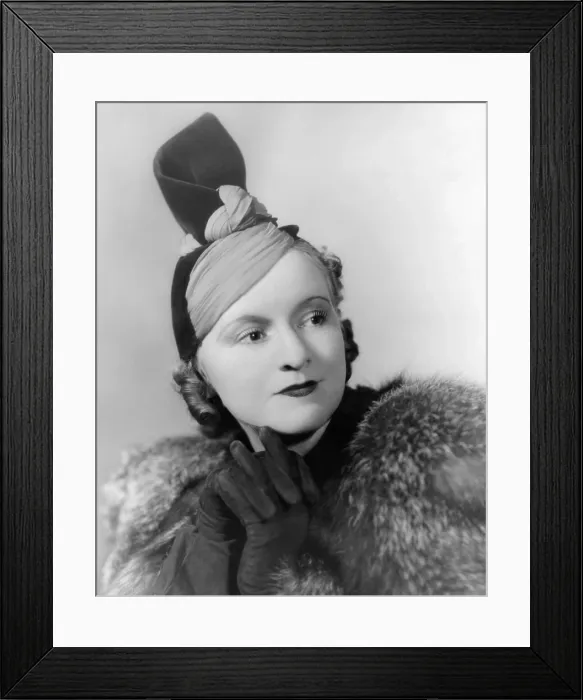 Framed Print : Hat by American designer and milliner Marian Valle. The two contrasting fabrics are twisted in a close to the head base that supports a high raised twist. 1937