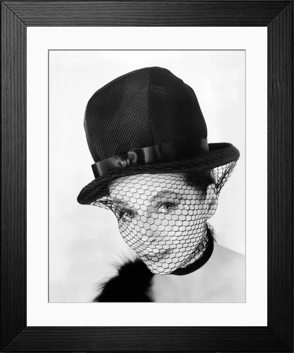 Framed Print : John Frederics hat from the early 1960s. It has an exaggerated bowler shape feminized by a netted veil secured by a black neck band Framed Print : John Frederics hat from the early 1960s. It has an exaggerated bowler shape feminized by a netted veil secured by a black neck band