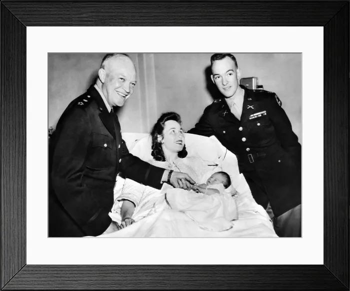 Framed Print : Dwight David Eisenhower II in his mother's arms. Grandpa Gen. Dwight David Eisenhower beams. At right is son and now father, Capt. John Eisenhower. April 1, 1948