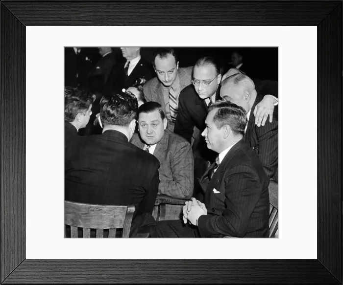 Framed Print : George Bugs Moran on trial for forgery. Moran (center) and Frank Parker (right) talk with defense attorney George Bieber (back to camera) in court in Chicago Framed Print : George Bugs Moran on trial for forgery. Moran (center) and Frank Parker (right) talk with defense attorney George Bieber (back to camera) in court in Chicago