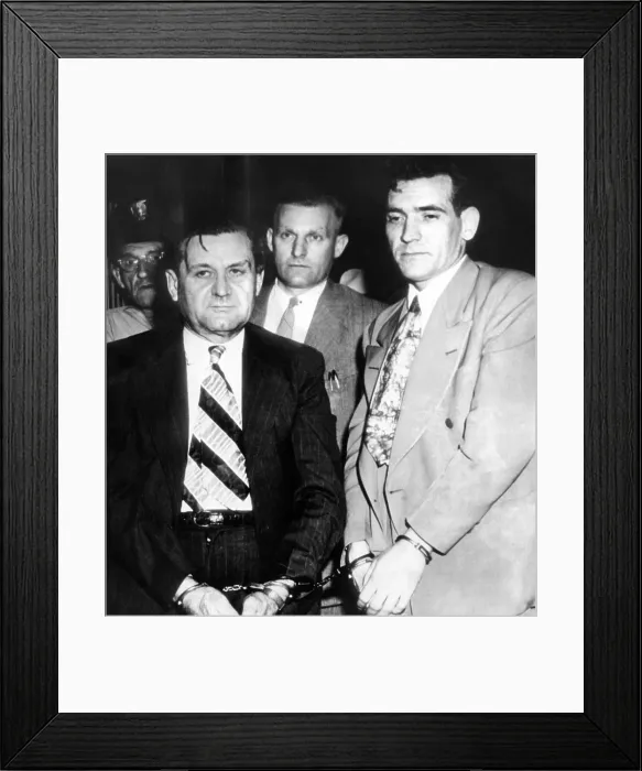 Framed Print : George Bugs Moran and Virgil Summers, booked at Dayton, Ohio, for a $10, 000 holdup of a local tavern. Behind are local police, in center, Detective C.M. Teeter