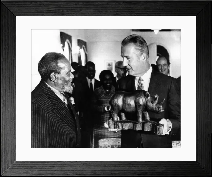 Framed Print : Vice President Spiro Agnew meeting with Kenya's Revolutionary President Jomo Kenyatta. Agnew holds a wooden carving of a rhinoceros presented to him by Kenyatta Framed Print : Vice President Spiro Agnew meeting with Kenya's Revolutionary President Jomo Kenyatta. Agnew holds a wooden carving of a rhinoceros presented to him by Kenyatta