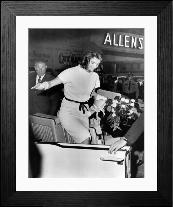 Framed Print : Jacqueline Kennedy balances gracefully as she exits a convertible on the day prior to President John Kennedy's assassination. Nov. 11, 1963 Framed Print : Jacqueline Kennedy balances gracefully as she exits a convertible on the day prior to President John Kennedy's assassination. Nov. 11, 1963