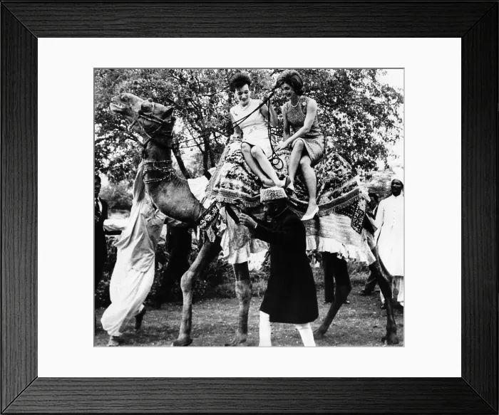 Framed Print : Jacqueline Kennedy and her sister, Princess Lee Radziwill riding a camel. The First Lady was on a good will trip to Pakistan. March 25, 1962