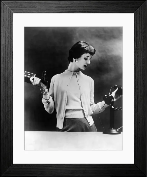 Framed Print : Sweater set of the 1950s. The 1955 fashion photo is staged with a 1920s telephone to emphasize the sweaters timelessness. (CSU_ALPHA_1309) CSU Archives / Everett Collection