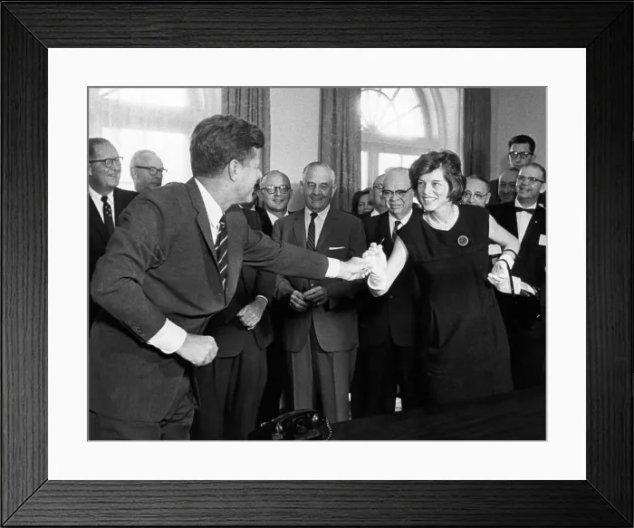 Framed Print : Eunice Shriver receives a signing pen from her brother, President John Kennedy. He called her the No. 1 lobbyist for the $355 million bill he just signed