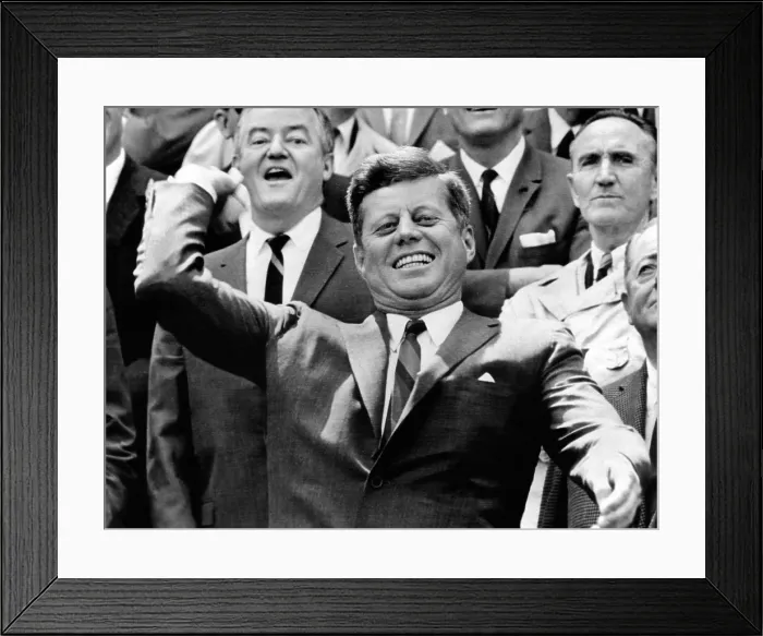 Framed Print : President John Kennedy opens the Baseball Season. He makes the ceremonial first pitch as Sen. Hubert Humphrey (left) and Mike Mansfield watch from behind. April 4, 1963