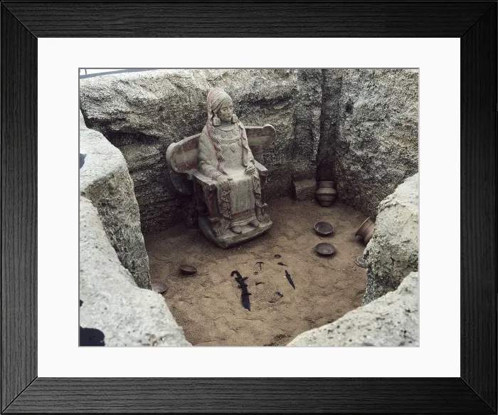 Framed Print : Lady of Baza. 4th c. BC. Reconstruction of chamber tomb no. 155, where it was found. Iberian art. Sculpture on rock. Proc: SPAIN. Baza. Necropolis of Cerro del Santuario