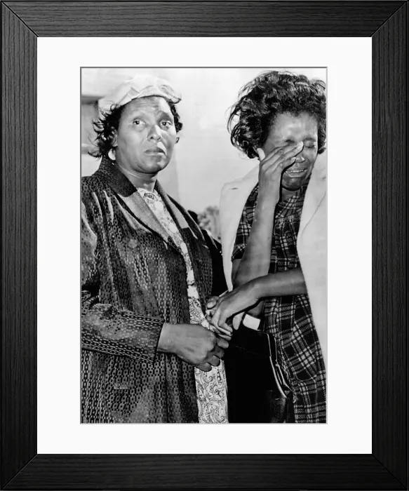 Framed Print : Two African American women stand outside Parkland Hospital in Dallas, mourning President John Kennedy's death. November 22, 1963