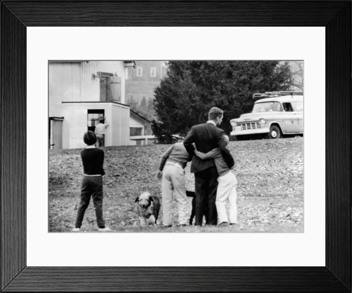 Framed Print : Robert Kennedy is comforted by two of his children on the lawn of his Hickory Hill home after he had been notified of the assassination of his brother, President John Kennedy