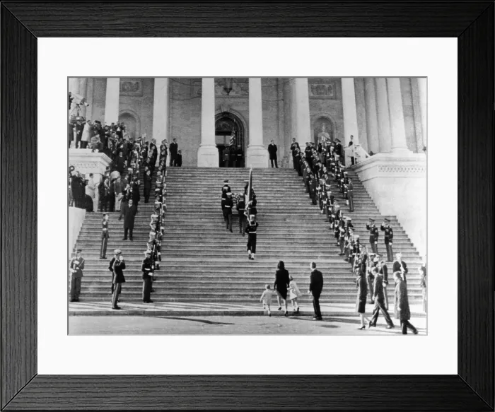 Framed Print : Jacqueline Kennedy escorts her children, Caroline and John, Jr. up the steps of the Capitol. They are following the casket of assassinated President John Kennedy