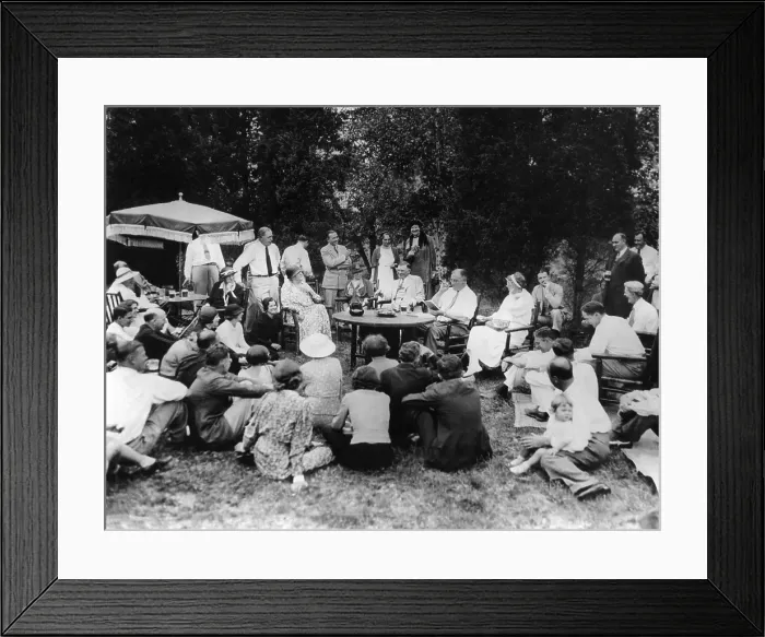 Framed Print : President Franklin Roosevelt hosts a picnic for their friends and neighbors at Val-Kil Cottage. FDR entertains the group with a reading Framed Print : President Franklin Roosevelt hosts a picnic for their friends and neighbors at Val-Kil Cottage. FDR entertains the group with a reading