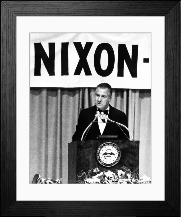 Framed Print : Spiro Agnew speaking in front of a large Nixon sign. He was at a $125 a plate fund raising dinner for Nassau County, New York. June, 29, 1972