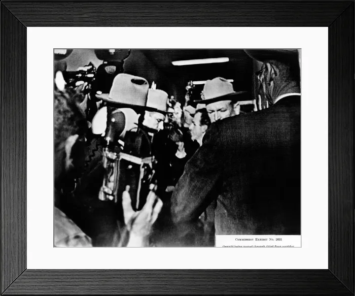 Framed Print : Warren Commission Exhibit. Television screen shot of suspected JFK assassin being moved through third floor corridor of the Dallas Police Station. Nov 22-24, 1963