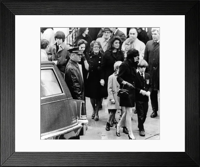 Framed Print : Kennedy family at the funeral of Joseph P. Kennedy. In the center is Jacqueline Kennedy Onassis and son, John, Jr. who is with Ann Gargan Framed Print : Kennedy family at the funeral of Joseph P. Kennedy. In the center is Jacqueline Kennedy Onassis and son, John, Jr. who is with Ann Gargan