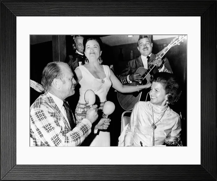 Framed Print : Vice President Gerald dancing with Maracas Rumba shakers. Betty Ford enjoys her serenade in Palm Springs, California. April 19, 1974