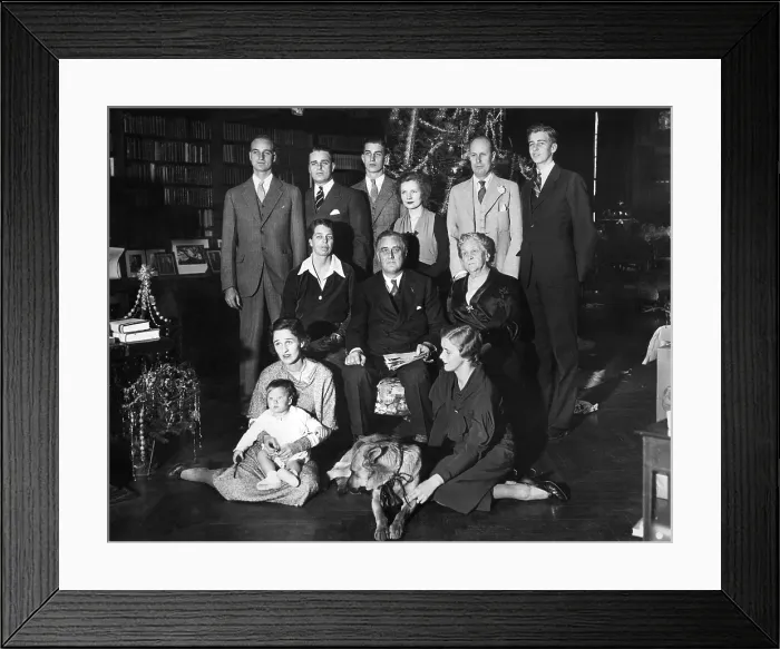 Framed Print : Franklin Roosevelt family on Christmas Day, 1932. President-elect and his family are shown grouped in front of the Christmas tree. L-R: Seated on the floor, Mrs
