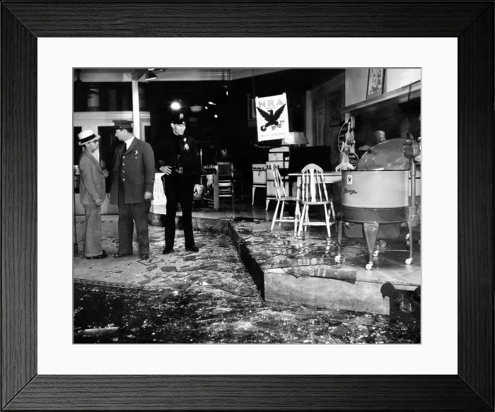 Framed Print : Earthquake damages a store in the heart of Los Angeles. A policeman guards an appliance store amidst broken glass. There were no fatalities. Oct. 2, 1933 Framed Print : Earthquake damages a store in the heart of Los Angeles. A policeman guards an appliance store amidst broken glass. There were no fatalities. Oct. 2, 1933