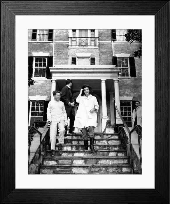 Framed Print : Jacqueline Kennedy, moving into her Federal Period Georgetown home. At her side is Joe Kennedy, son of Attorney General Robert and Ethel Kennedy. Person at center is unidentified