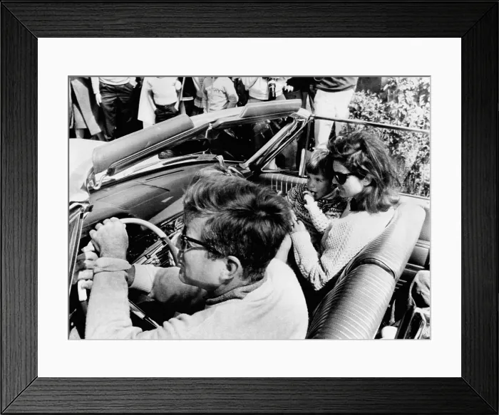 Framed Print : President Kennedy drives an open car in Newport, Rhode Island, leaving for a Narragansett Bay cruise aboard the Kennedy family yacht Framed Print : President Kennedy drives an open car in Newport, Rhode Island, leaving for a Narragansett Bay cruise aboard the Kennedy family yacht