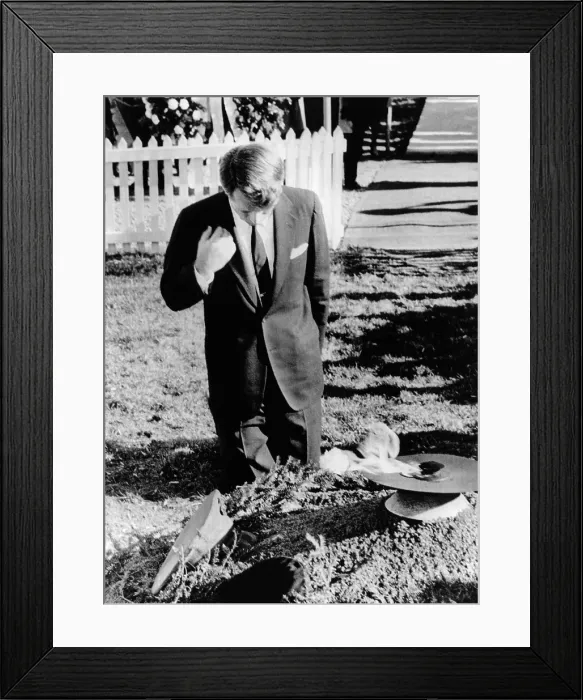 Framed Print : Robert Kennedy prays at his brother's grave. On the first anniversary of the John Kennedy assassination, the new Senator-elect attended a Memorial Mass at St