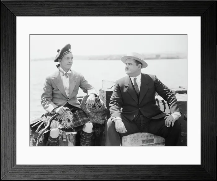 Framed Print : PUTTING PANTS ON PHILIP, from left: Stan Laurel, Oliver Hardy, 1927